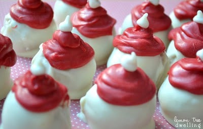 Oreo Truffles flavored with raspberry extract and decorated to look like adorable little Santa hats!