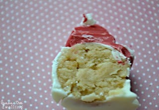 Oreo Truffles flavored with raspberry extract and decorated to look like adorable little Santa hats!