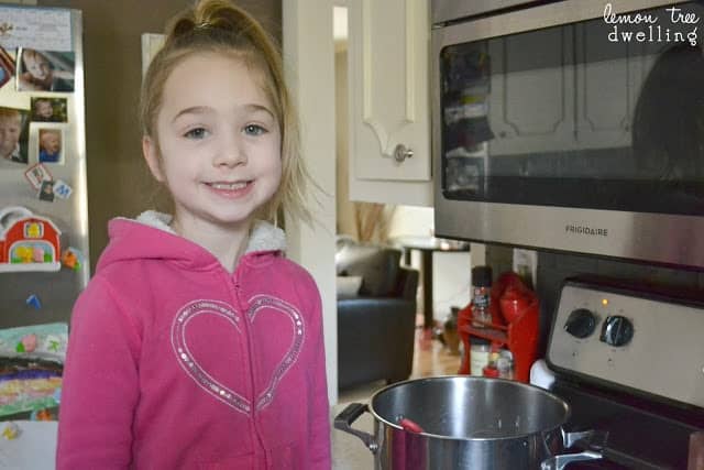 little girl wearing a pink shirt with a heart on it