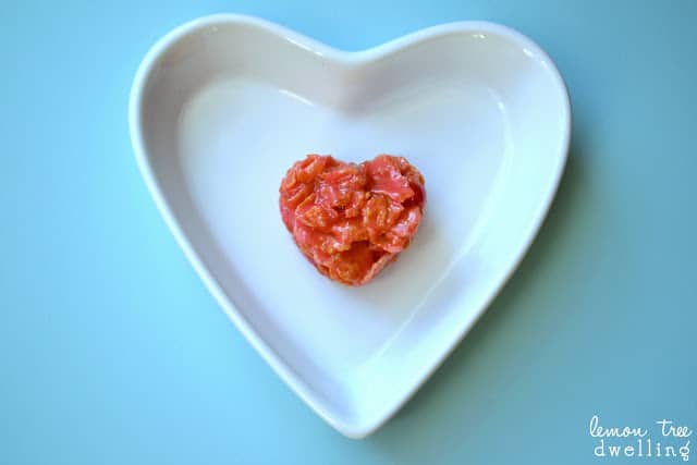 white heart shaped platter with a redheart shaped marshmallow treat in the center