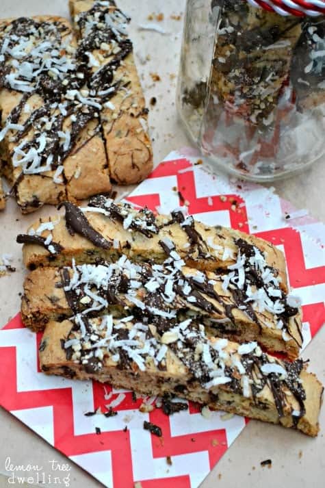 Almond Joy Biscotti is sinfully delicious! This rich biscotti is stuffed with chocolate, coconut, and almonds and drizzled with more of the same! 