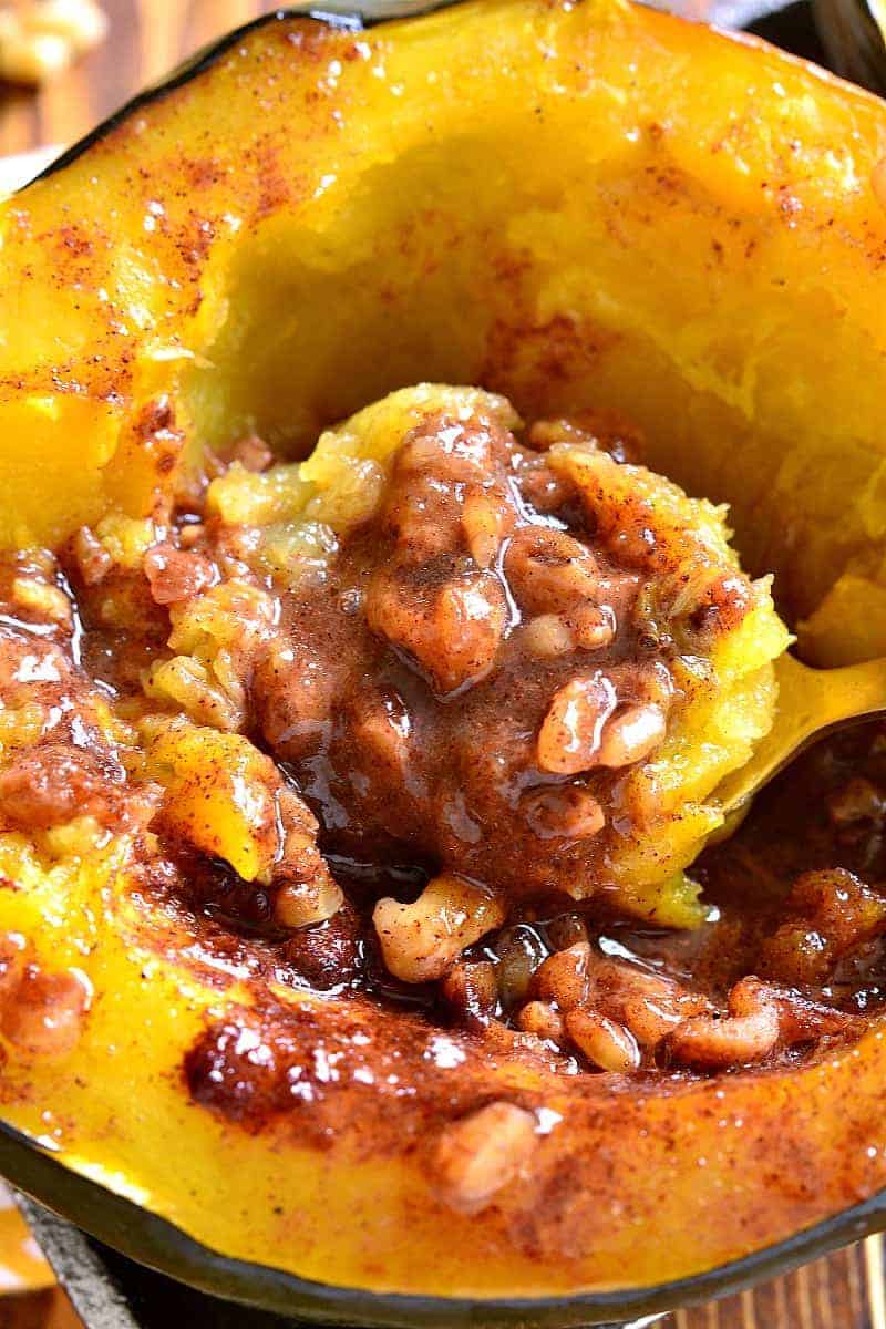 Tender Acorn Squash baked with brown sugar, butter, cinnamon, nutmeg, and walnuts. A delectable side dish....perfect for the holidays! 
