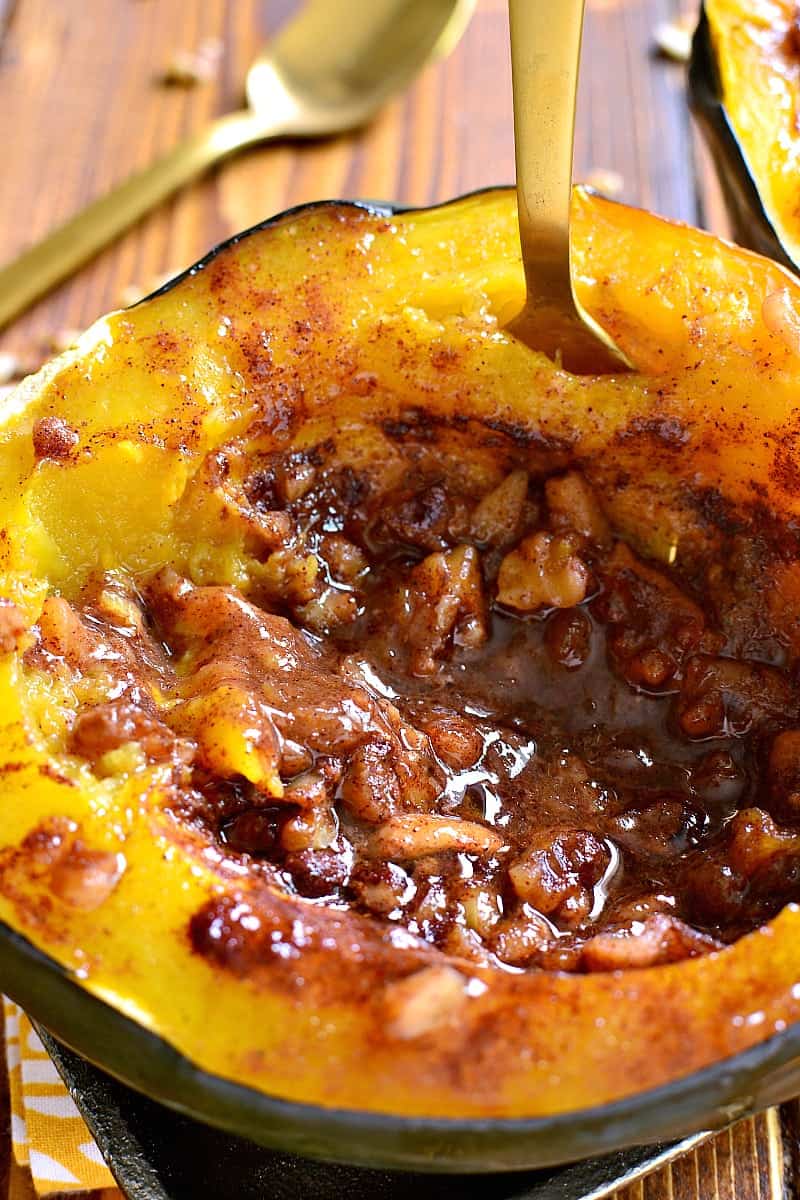 Tender Acorn Squash baked with brown sugar, butter, cinnamon, nutmeg, and walnuts. A delectable side dish....perfect for the holidays! 