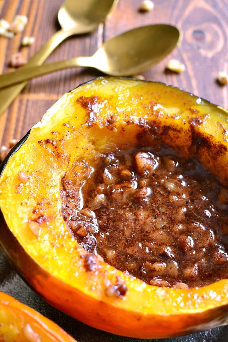 Tender Acorn Squash baked with brown sugar, butter, cinnamon, nutmeg, and walnuts. A delectable side dish....perfect for the holidays! 