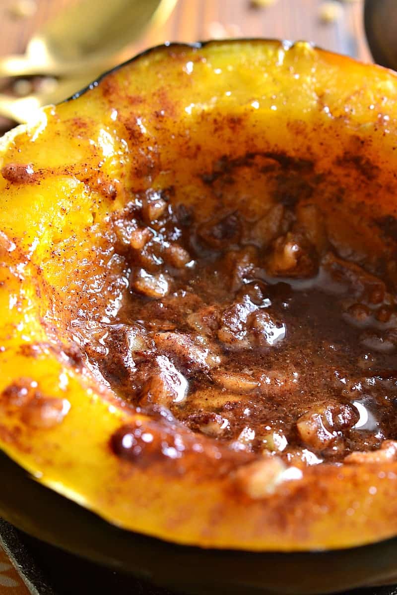 Tender Acorn Squash baked with brown sugar, butter, cinnamon, nutmeg, and walnuts. A delectable side dish....perfect for the holidays! 