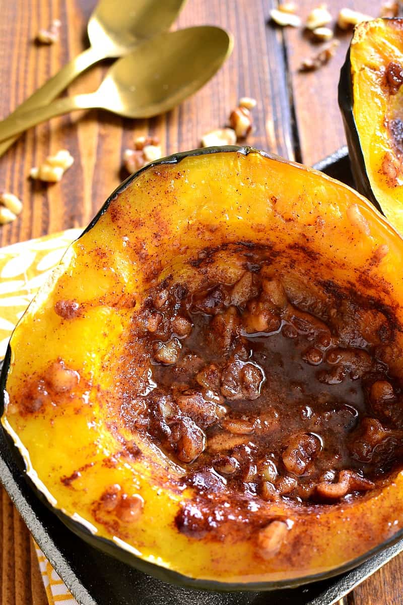 Tender Acorn Squash baked with brown sugar, butter, cinnamon, nutmeg, and walnuts. A delectable side dish....perfect for the holidays! 