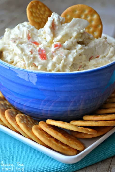 Crock Pot Crab Dip is a deliciously creamy dip made with 2 different kinds of cheese, imitation crab, and a splash of white wine. It's simple, it's delicious, and best of all.....it's made in a crock pot! 