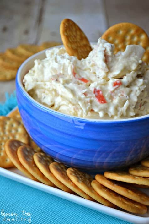 Crock Pot Crab Dip is a deliciously creamy dip made with 2 different kinds of cheese, imitation crab, and a splash of white wine. It's simple, it's delicious, and best of all.....it's made in a crock pot! 