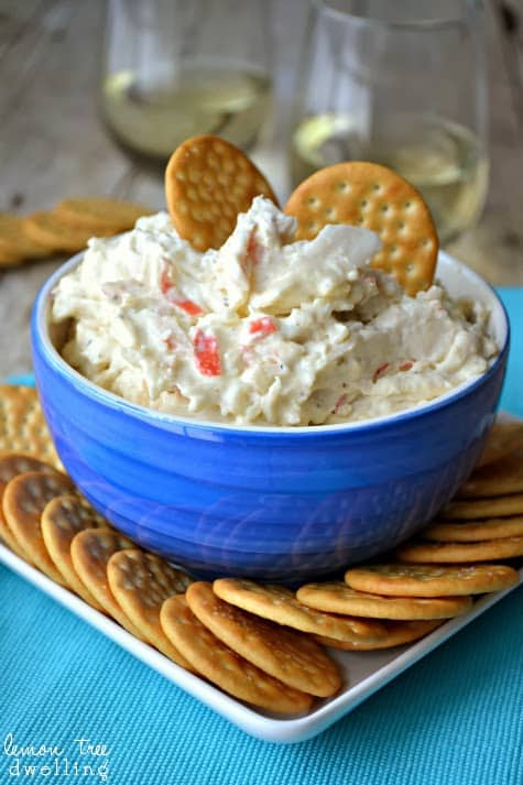 Crock Pot Crab Dip is a deliciously creamy dip made with 2 different kinds of cheese, imitation crab, and a splash of white wine. It's simple, it's delicious, and best of all.....it's made in a crock pot! 