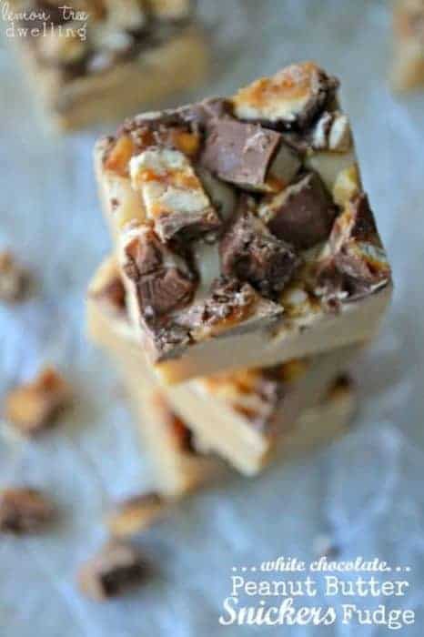 White Chocolate Peanut Butter Snickers Fudge will be the hit of your holiday party! These creamy fudge morsels take 5 minutes or less to make, and 2 seconds to eat! Simply delicious and a perfect sweet treat.