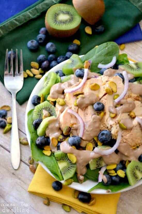 This Pistachio Spinach Salad is filled with delicious fresh ingredients and marinated chicken breast, perfect with a creamy balsamic dressing.