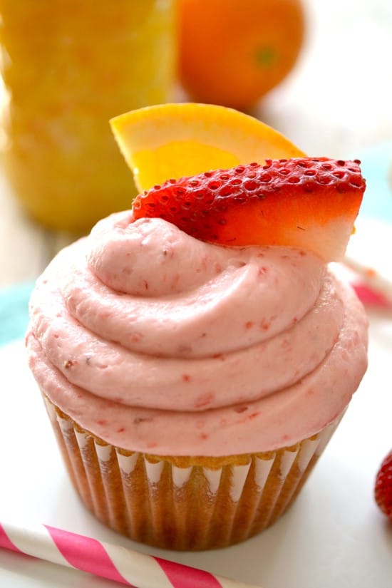 Sunrise Cupcakes! Filled with homemade orange curd and topped with fresh strawberry buttercream. SUCH a delicious combination!