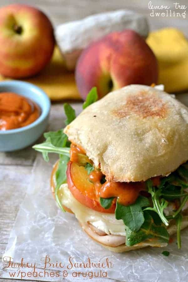 Turkey-Brie Sandwich with peaches, arugula, & spicy mayo