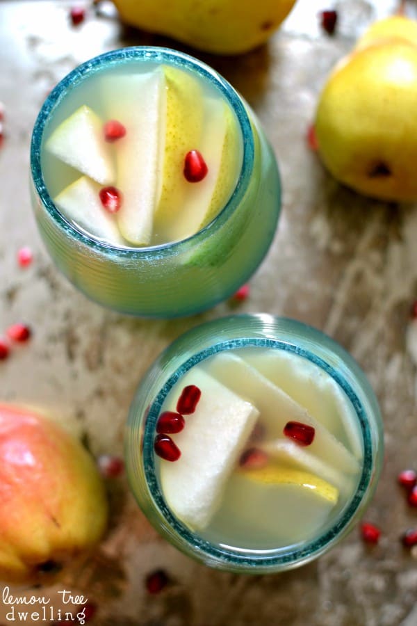Pear Sangria with fresh pears and pomegranate seeds. Can't wait to try this!
