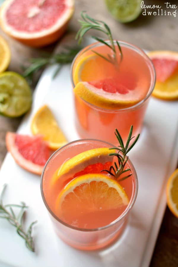 Ruby Red Rosemary Cocktail is a refreshing drink that makes a surprising addition to your fall table. Ruby red grapefruit juice with a splash of lemon and lime and a sweet rosemary simple syrup