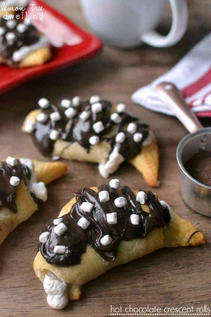 Hot Chocolate Crescent Rolls - stuffed with sweet hot chocolate cream cheese and marshmallow fluff and drizzled in milk chocolate and more marshmallows!