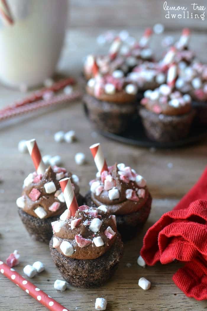 Peppermint Hot Chocolate Cookie Cups are a deliciously sinful dessert topped with peppermint chocolate buttercream, peppermint candies, and marshmallow bits. 