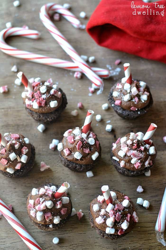 Peppermint Hot Chocolate Cookie Cups are a deliciously sinful dessert topped with peppermint chocolate buttercream, peppermint candies, and marshmallow bits. 