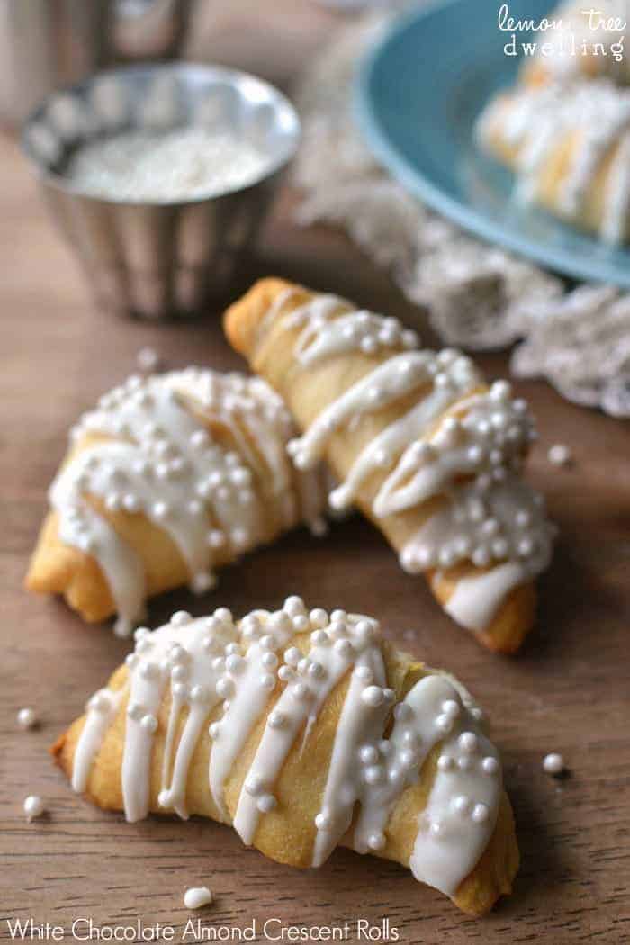  White Chocolate Almond Crescent Rolls will please any crowd and are so simple to make. These easy rolls are not only delicious, they're so pretty, too! Perfect for New Year's morning, a wedding shower, or any special occasion.