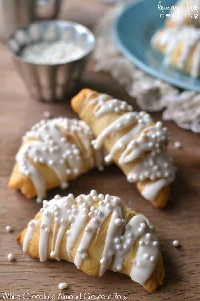 White Chocolate Almond Crescent Rolls will please any crowd and are so simple to make. These easy rolls are not only delicious, they're so pretty, too! Perfect for New Year's morning, a wedding shower, or any special occasion.