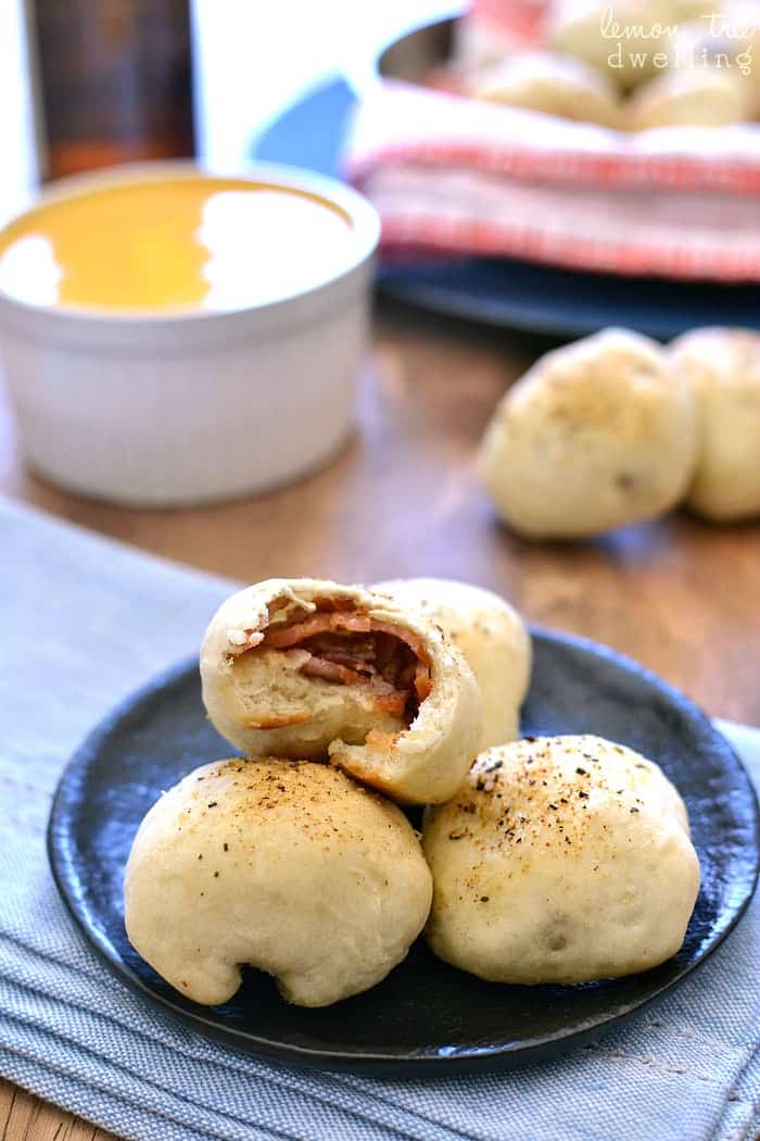 Bacon Bombs with Beer Cheese Dipping Sauce will be your new favorite appetizer! These bite sized rolls with bacon are the perfect combination for game day!