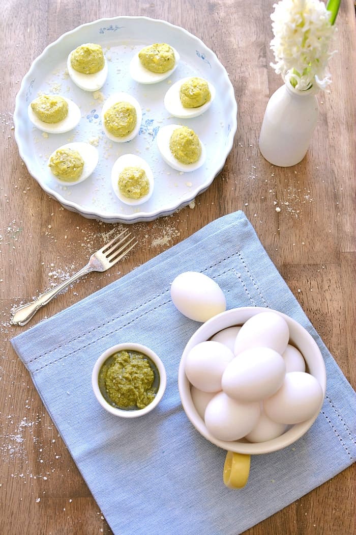 Parmesan Pesto Deviled Eggs are a easy and delicious protein snack or breakfast treat for Easter. These 5-ingredient deviled eggs are flavored with a touch of lemon and a big burst of flavor!