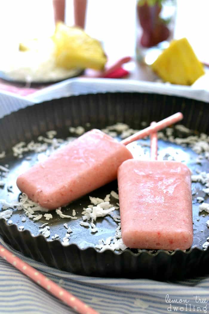 Strawberry Colada Popsicles made with coconut milk, fresh fruit, and Truvia!