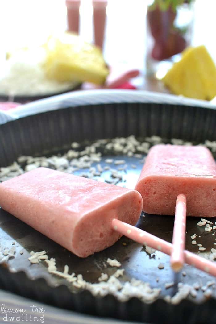 Strawberry Colada Popsicles made with coconut milk, fresh fruit, and Truvia!