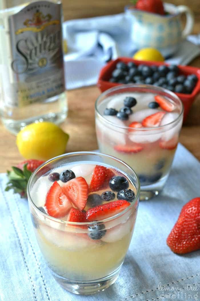 Lemon Margaritas made with organic pure lemon juice and garnished with fresh berries. The perfect drink for summer!