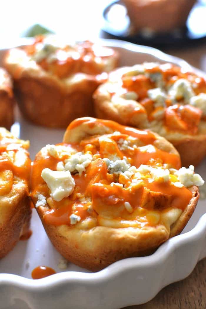  These Buffalo Chicken Pizza Cups are made with just 5 ingredients and are perfect for snack, lunch, or dinner! Make them in a muffin tin for an extra fun twist on pizza!