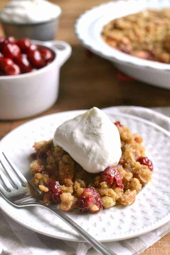  Homemade Cherry Crisp, packed with almonds and topped with a thick layer of crunchy brown sugar streusel. Serve it with homemade amaretto whipped cream for an extra special treat!