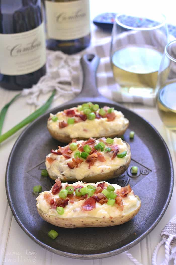 These Cheesy Bacon Potato Skins are loaded with three types of cheese, smoky bacon, and crisp chardonnay. Perfect for game day, ladies' night, or anytime in between!