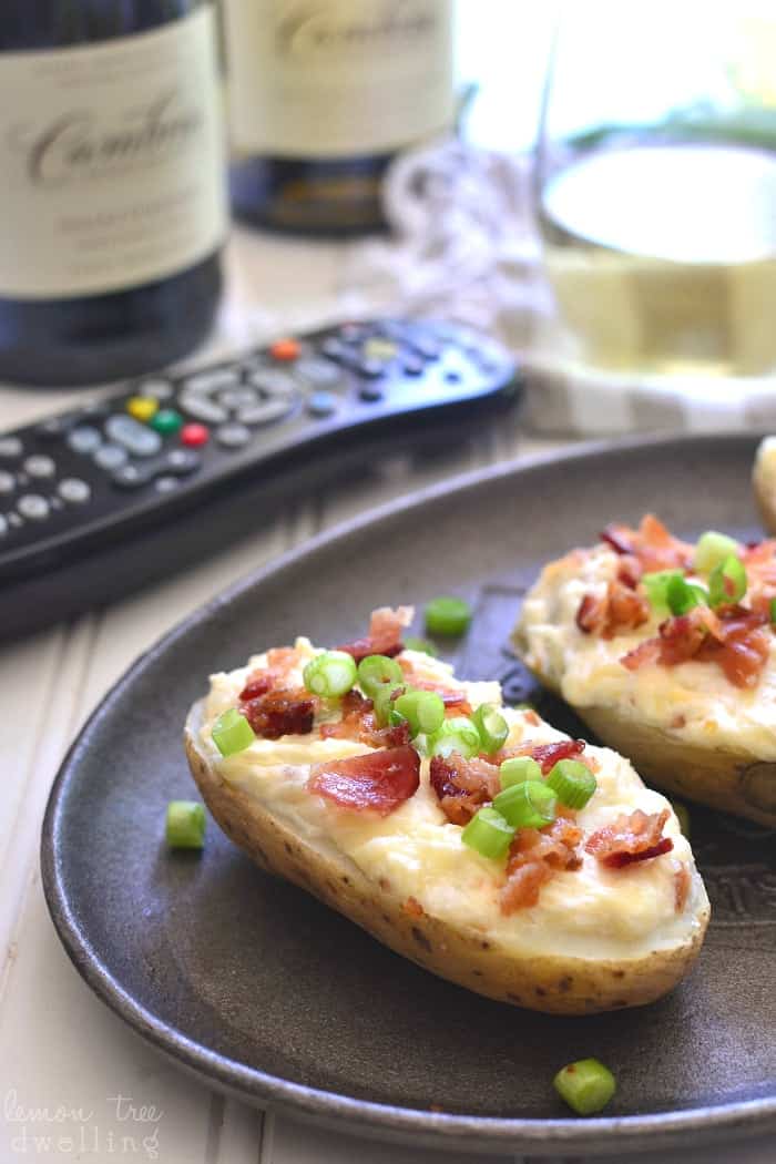 These Cheesy Bacon Potato Skins are loaded with three types of cheese, smoky bacon, and crisp chardonnay. Perfect for game day, ladies' night, or anytime in between!