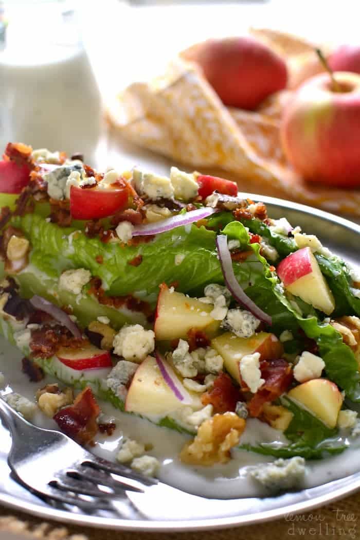  This Apple Wedge Salad is loaded with fresh apples, chopped walnuts, crispy bacon, and gorgonzola cheese, then topped with a sweet, creamy golden balsamic dressing! The perfect salad for fall!