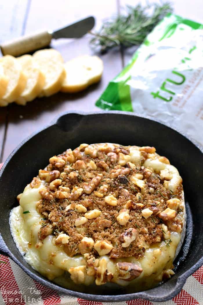 This Brown Sugar Walnut Baked Brie is the perfect blend of savory and sweet and makes a delicious holiday appetizer! Serve it with fresh bread, apple slices, or crackers for a quick and easy snack that's sure to please all your holiday guests!