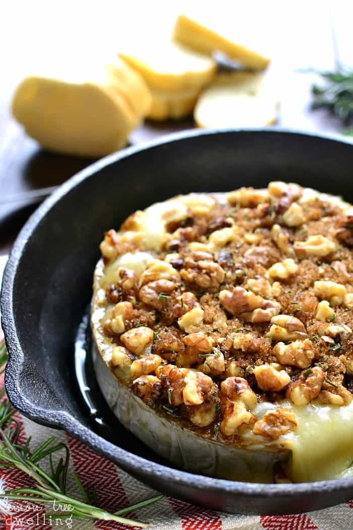 This Brown Sugar Walnut Baked Brie is the perfect blend of savory and sweet and makes a delicious holiday appetizer! Serve it with fresh bread, apple slices, or crackers for a quick and easy snack that's sure to please all your holiday guests!