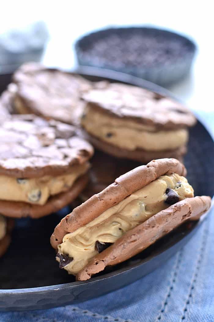 These Peanut Butter-Filled Chocolate Sandwich Cookies are the perfect pairing of two favorite flavors. Chewy chocolatey cookies meet creamy peanut butter frosting in these deliciously dreamy sandwich cookies!