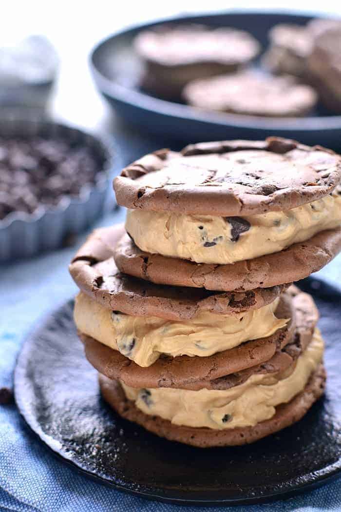 These Peanut Butter-Filled Chocolate Sandwich Cookies are the perfect pairing of two favorite flavors. Chewy chocolatey cookies meet creamy peanut butter frosting in these deliciously dreamy sandwich cookies!
