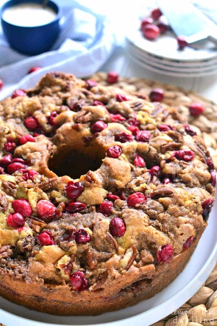 This Cranberry-Pecan Coffee Cake is packed with fresh cranberries, pecans, and brown sugar streusel, then topped with a creamy vanilla glaze. Serve it for breakfast or dessert....either way, it's perfect for the holidays!