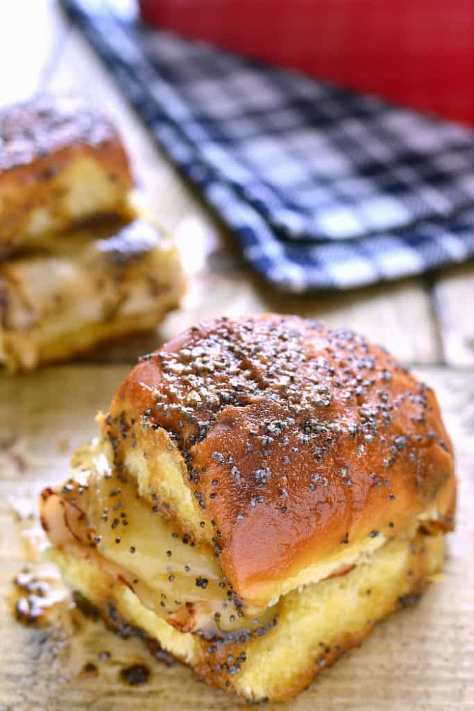 These Baked Turkey & Cheese Sandwiches are a family favorite! Make them ahead for game day, dinner, or your next party!