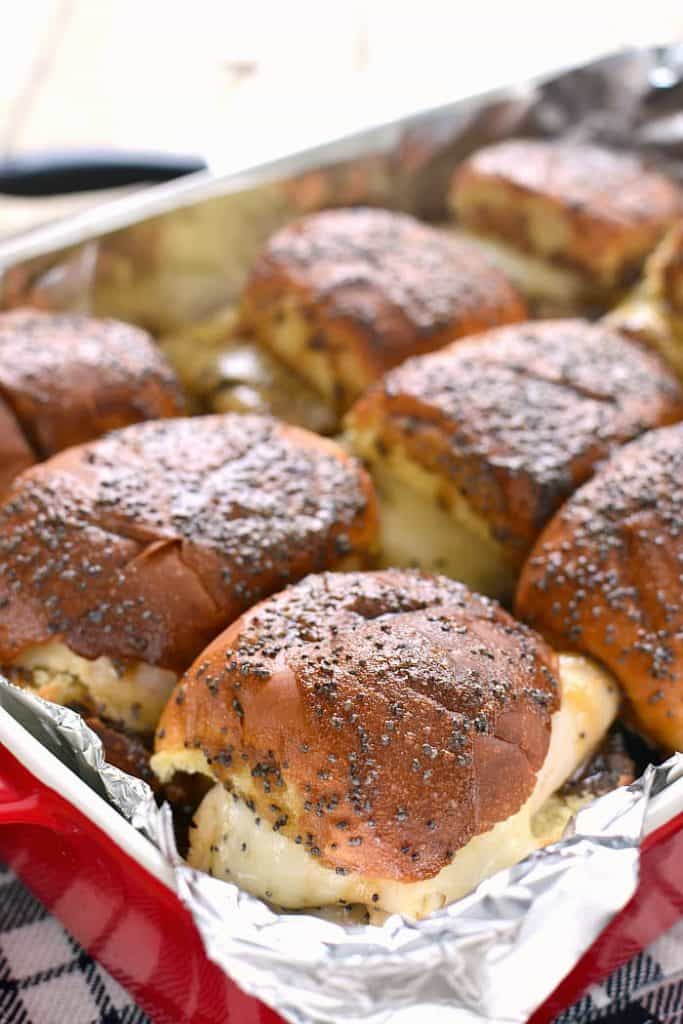 These Baked Turkey & Cheese Sandwiches are a family favorite! Make them ahead for game day, dinner, or your next party!