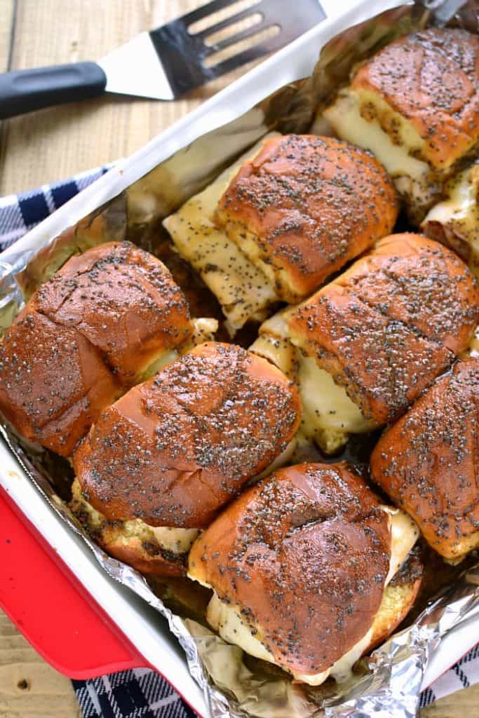 These Baked Turkey & Cheese Sandwiches are a family favorite! Make them ahead for game day, dinner, or your next party!