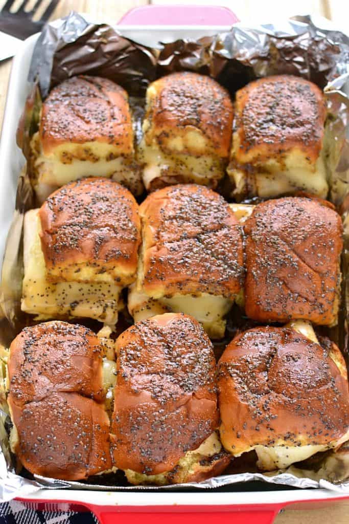 These Baked Turkey & Cheese Sandwiches are a family favorite! Make them ahead for game day, dinner, or your next party!