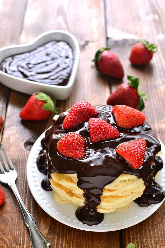  These Chocolate Covered Strawberry Pancakes are light and fluffy, topped with fresh strawberries and rich chocolate ganache. Perfect for Valentine's Day or any special occasion!
