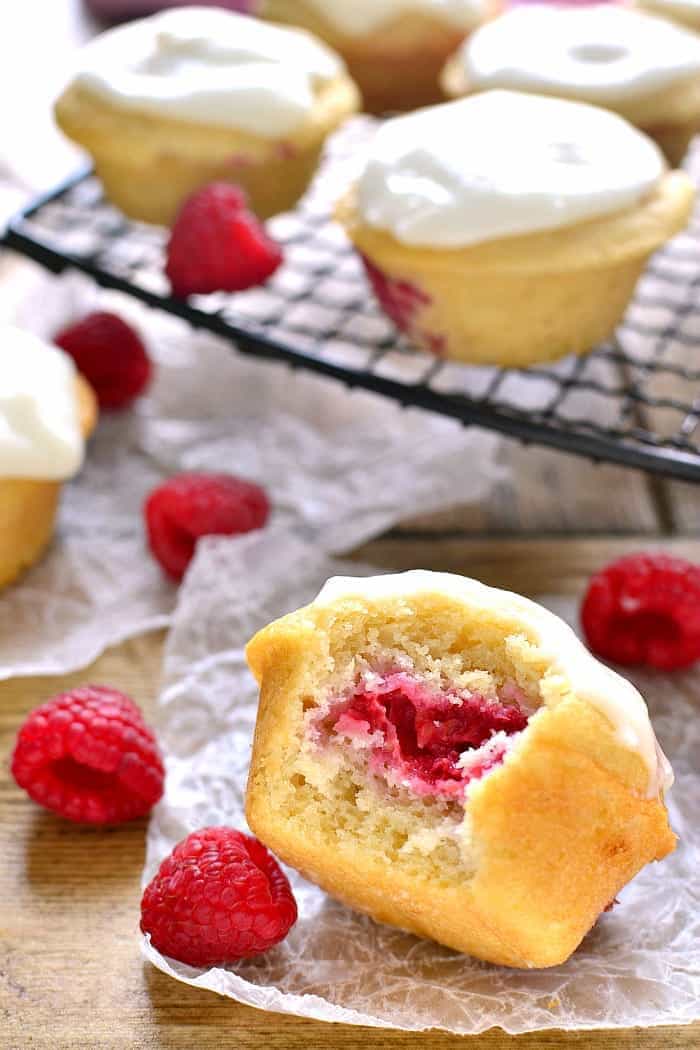 These Iced Raspberry Muffins are loaded with fresh raspberries and topped with a deliciously sweet cream cheese icing. The perfect way to start  your day!