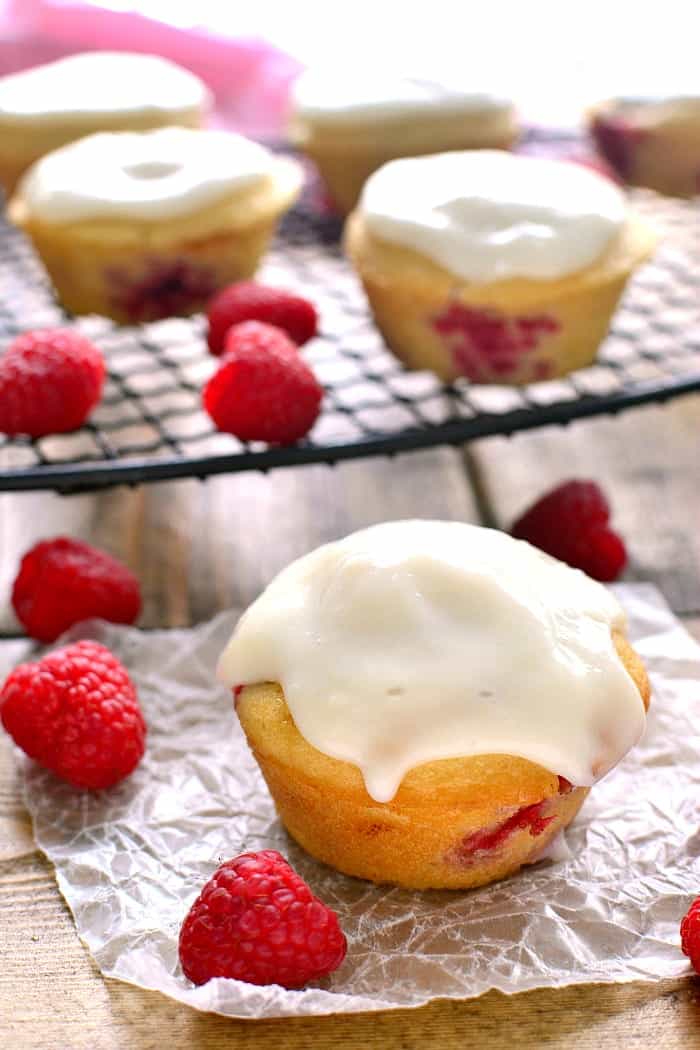 These Iced Raspberry Muffins are loaded with fresh raspberries and topped with a deliciously sweet cream cheese icing. The perfect way to start  your day!