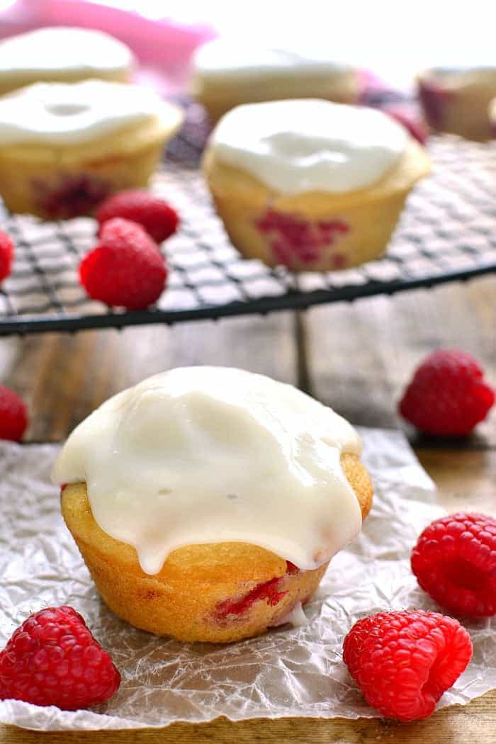 These Iced Raspberry Muffins are loaded with fresh raspberries and topped with a deliciously sweet cream cheese icing. The perfect way to start  your day!