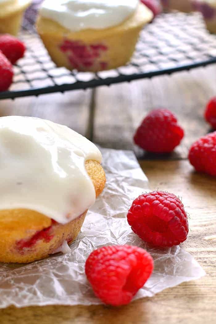 These Iced Raspberry Muffins are loaded with fresh raspberries and topped with a deliciously sweet cream cheese icing. The perfect way to start  your day!