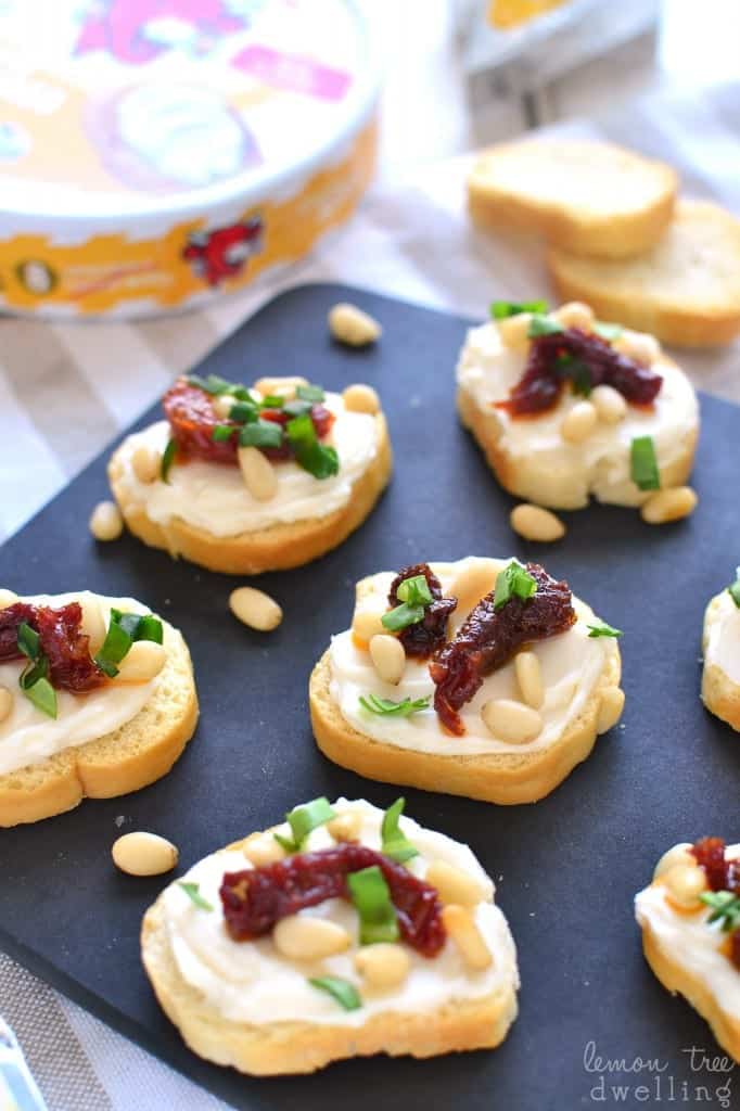 Sun Dried Tomato Asiago Crostini is made with just 5 simple ingredients and packed with delicious flavor! Perfect for snacking, sharing, or serving at your next party!