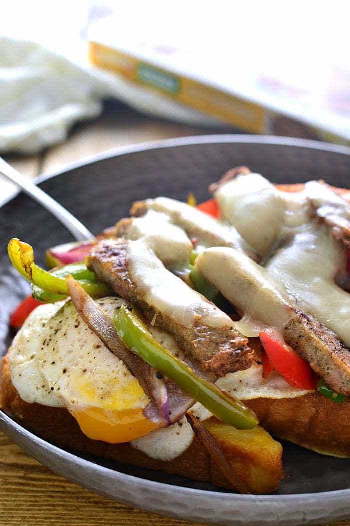These Breakfast Cheesesteaks are everything you could want in a breakfast sandwich! They start with French toast and are topped with eggs, peppers, onions, cheese, and Jones Dairy Farm Chicken Sausage Patties. Perfect for breakfast, brunch, or brinner!